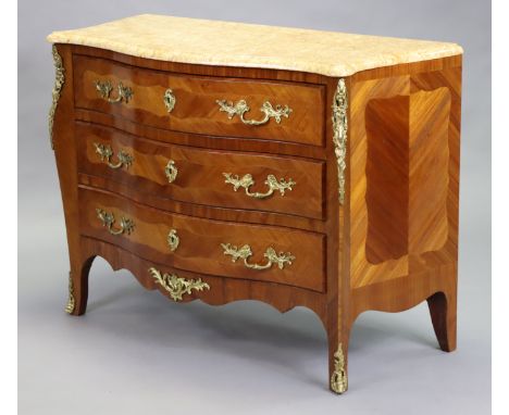 A Louis XVI-style kingwood-veneered serpentine commode with yellow marble top and gilt-metal mounts, fitted three long drawer