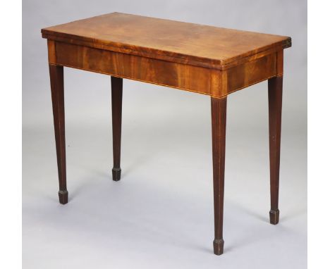 A 19th century mahogany rectangular fold-over top card table, inset green baize, on fluted square tapering legs, 87.5cm wide 