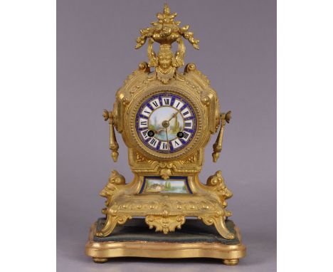 A 19th century French gilt-metal &amp; porcelain-mounted mantel clock, the enamelled dial with painted landscape &amp; roman 