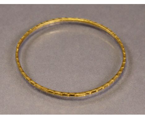 An Egyptian gold stiff bangle with facet-&amp;-bead design (11.5g).