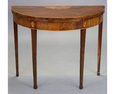 A late 18th century mahogany and satinwood crossbanded demi-lune card table with fold-over top, inset green baize, on square 