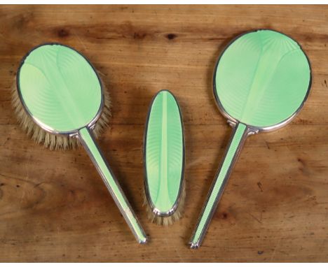 A George VI engine-turned silver &amp; lime-green enamelled hand mirror; clothes brush; &amp; hairbrush; Birmingham 1939-40, 