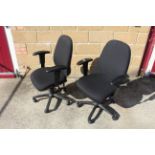 A pair of revolving adjustable office chairs with arm rests SUBJECT TO VAT