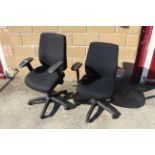 A pair of revolving adjustable office chairs with arm rests SUBJECT TO VAT