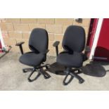 A pair of revolving adjustable office chairs with arm rests SUBJECT TO VAT