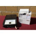 Mortara ELI230 electrocardiograph in hard carry case with 2x boxes containing a quantity of SKINTACT