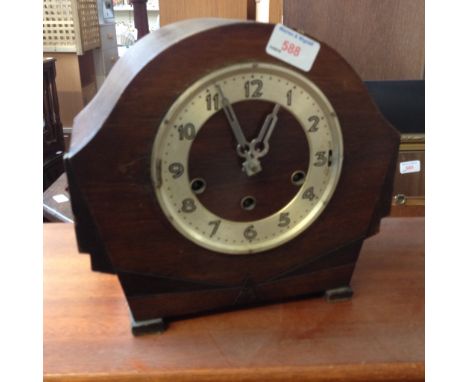 AN OAK MANTLE CLOCK