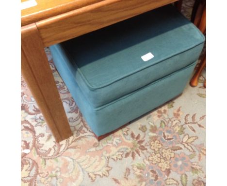 A GREEN POUFFE