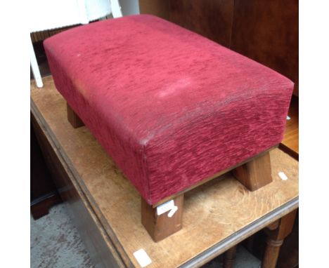 A RED CLOTH POUFFE