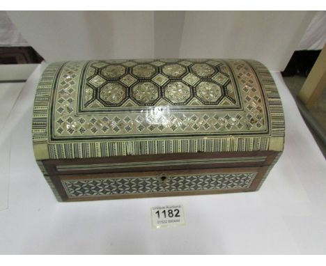 A large jewellery box with mother of pearl inlay