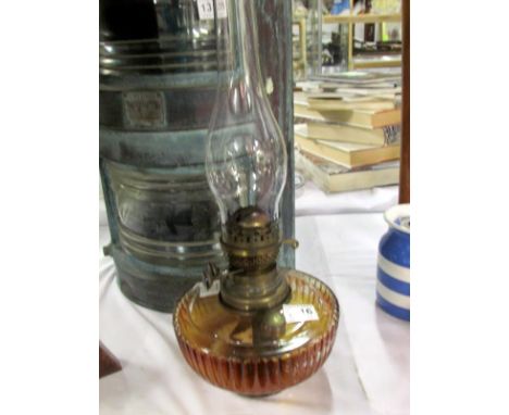 A glass oil lamp