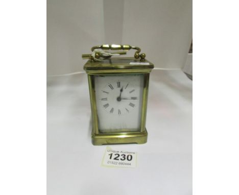 A brass carriage clock, glass a/f