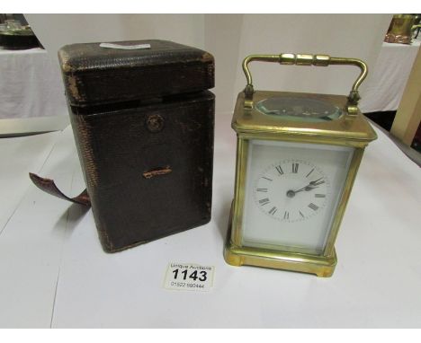 A cased Victorian  brass carriage clock