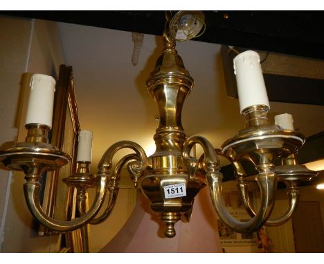 A heavy brass 5 lamp ceiling light