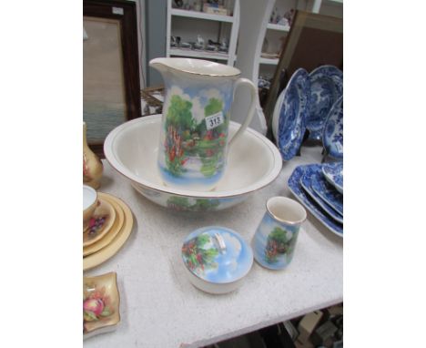 A cottage scene jug and basin set with soap dish and toothbrush jar