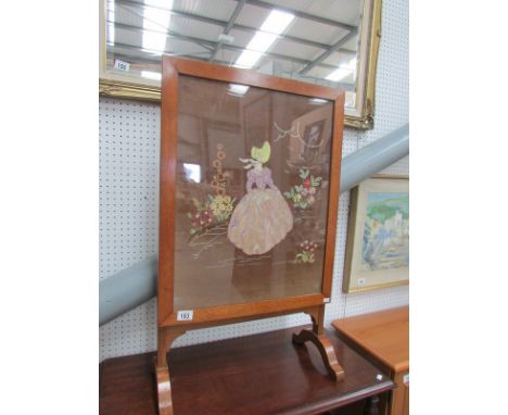 An oak fire screen with embroidered panel