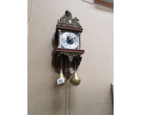 A contemporary wall clock with Delft tile face