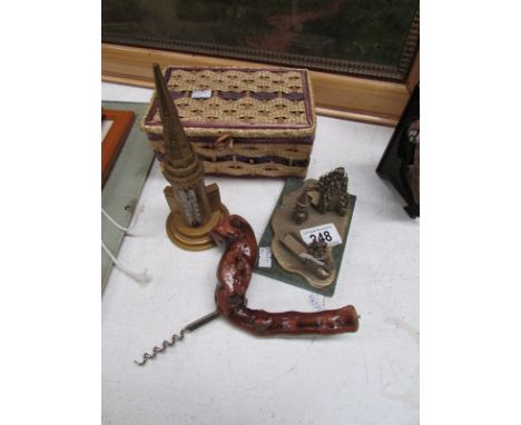 A corkscrew, thermometer, sewing basket and paperweight
