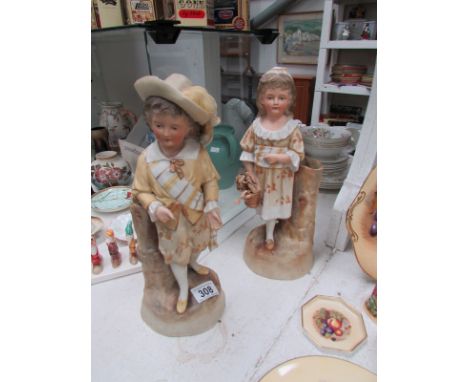 A pair of bisque figures, a/f