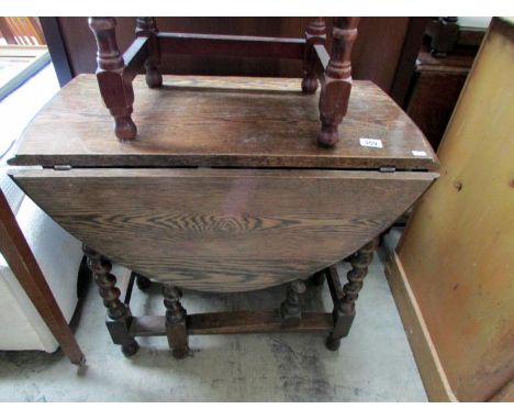 An oak barley twist gate leg table