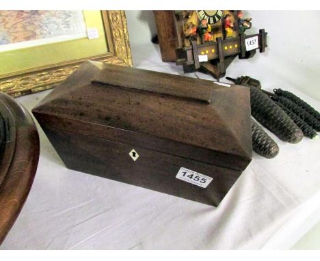 A mahogany tea caddy with individual liners