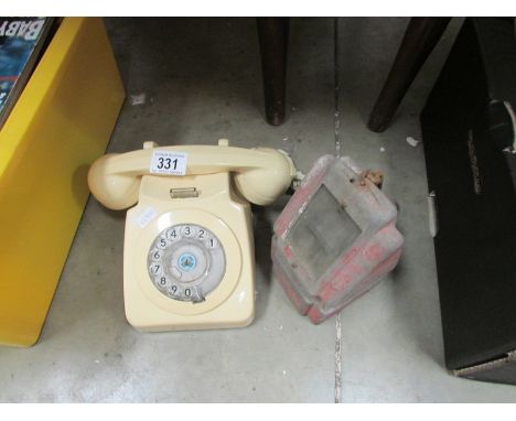 A vintage telephone and one other item