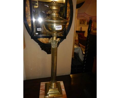 A brass Corinthian column oil lamp base