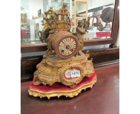 A French mantel clock with porcelain panels