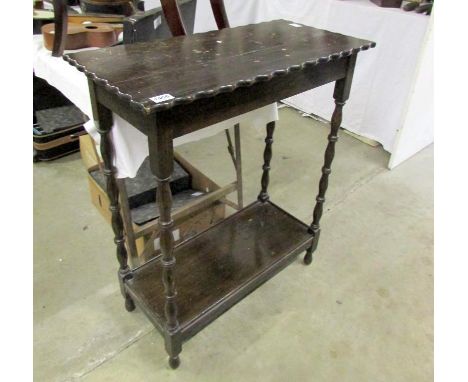 An oak side table with bobbin legs