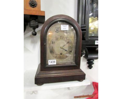 A domed top mahogany mantel clock