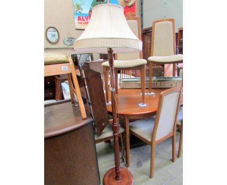 A standard lamp with shade