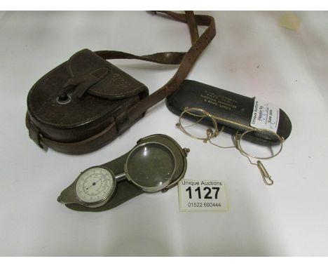 A military WW1 compass case, cased pince nez, magnifying glass etc