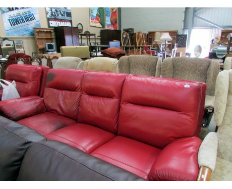 An electric red leather sofa and matching electric chair (some staining to sofa)