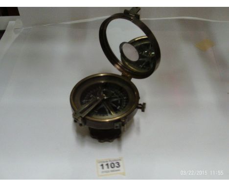 A silvered brass compass marked Elliot Bros. London