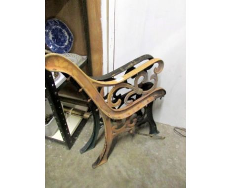 A pair of cast iron bench ends