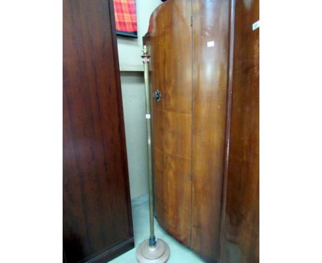 A brass standard lamp with reeded column