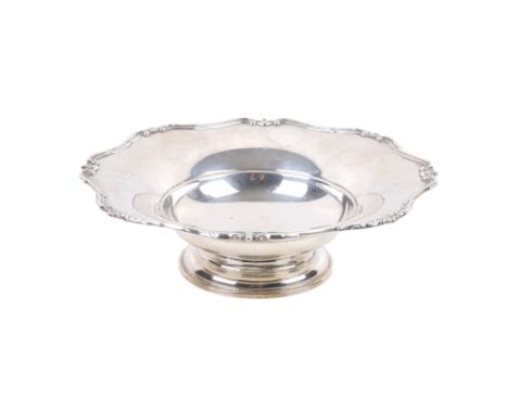 A George V silver dish. With a cased piecrust rim, on a stepped cylindrical base, maker Adie Brothers Ltd, Birmingham 1933, H