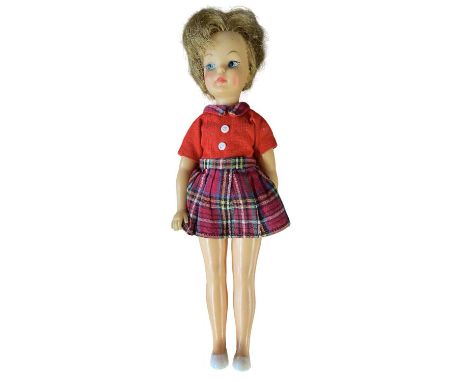 Pepper (Tammy's sister), Ideal Toy Corp 1965In tartan skirt and red blouse with white dolly shoes.Marked to rear of head G9-E