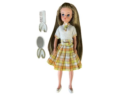 Lovely Lively Sindy (Pedigree c1970s)In checkered orange, yellow and white skirt with white blouse and matching trim. Includi