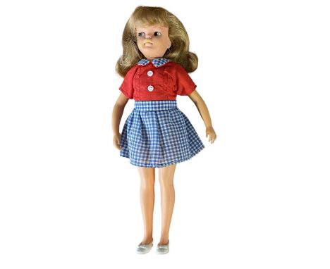 Pepper (Tammy's sister), Ideal Toy Corp 1965.In blue and white gingham skirt, red blouse and white shoes.Marked to rear of he