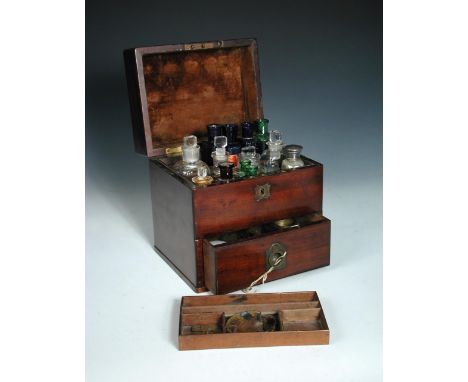 A 19th century mahogany apothecary box with single drawer and fitted interior, containing twenty one glass bottles of varying