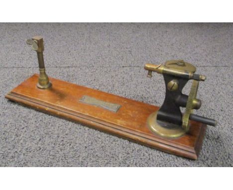 A galvanometer resistance testing tool, housed in a mahogany case, by F.F. Becker & Co., London, together with a piece of yar