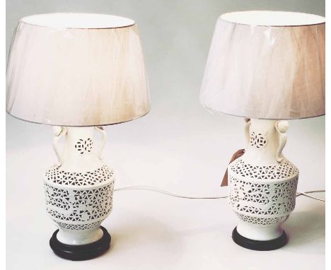 LAMPS, a pair, reticulated white ceramic of vase form with shades, 76cm H. (2)