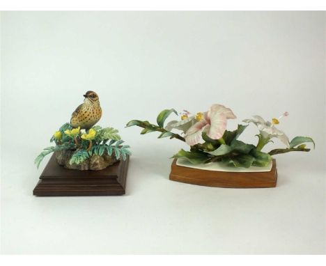 A Royal Worcester model of a Meadow Pipit and Silverweed together with a further Royal Worcester model of Hibiscus, printed f