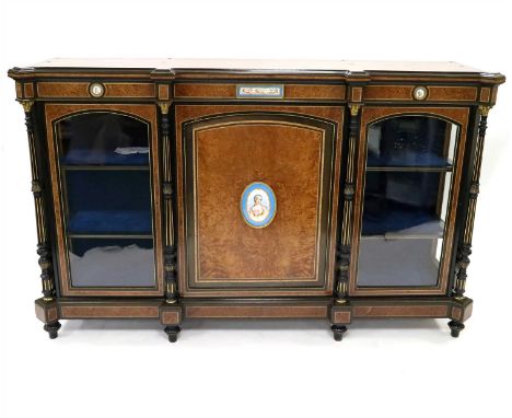 A large Victorian credenza, veneered principally in burr walnut with strung and cross-banded borders, the rectangular top abo