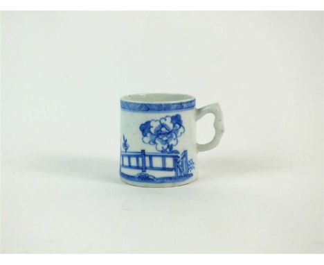 A Bow porcelain blue and white coffee can painted in underglaze blue with flowering rockwork, prunus and a fence below a cros