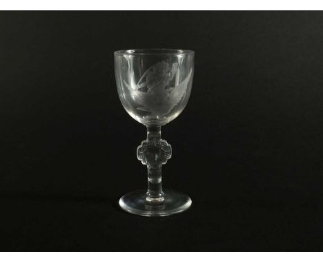 A small Art Deco René Lalique wine glass the bowl engraved with a putto holding a quill in one hand and letter in the other, 