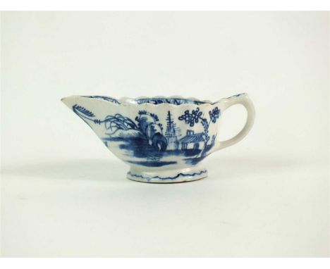 A small Bow blue and white oval fluted creamboat circa 1755-60, painted with the `Desirable Residence' pattern, unmarked, 5cm