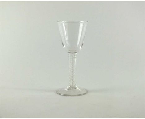 A George III opaque twist stem wine glass circa 1770 the round funnel bowl above a single series opaque twist stem and a coni