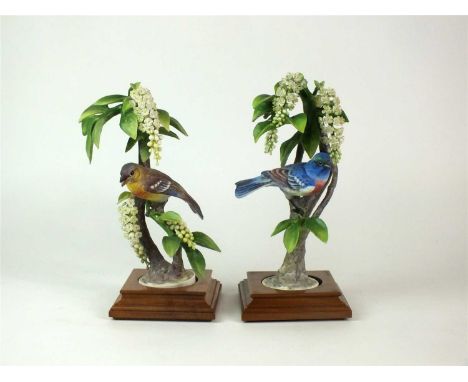 A pair of Royal Worcester models of Lazuli Bunting perched upon Choke Cherry circa 1962, limited editions of 500 designed by 